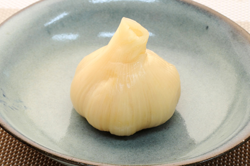 Sweet and sour pickled whole garlic
